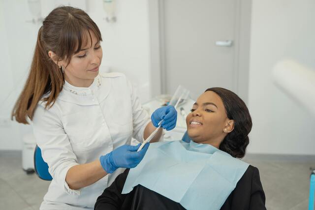 female dentist and patient dental checks